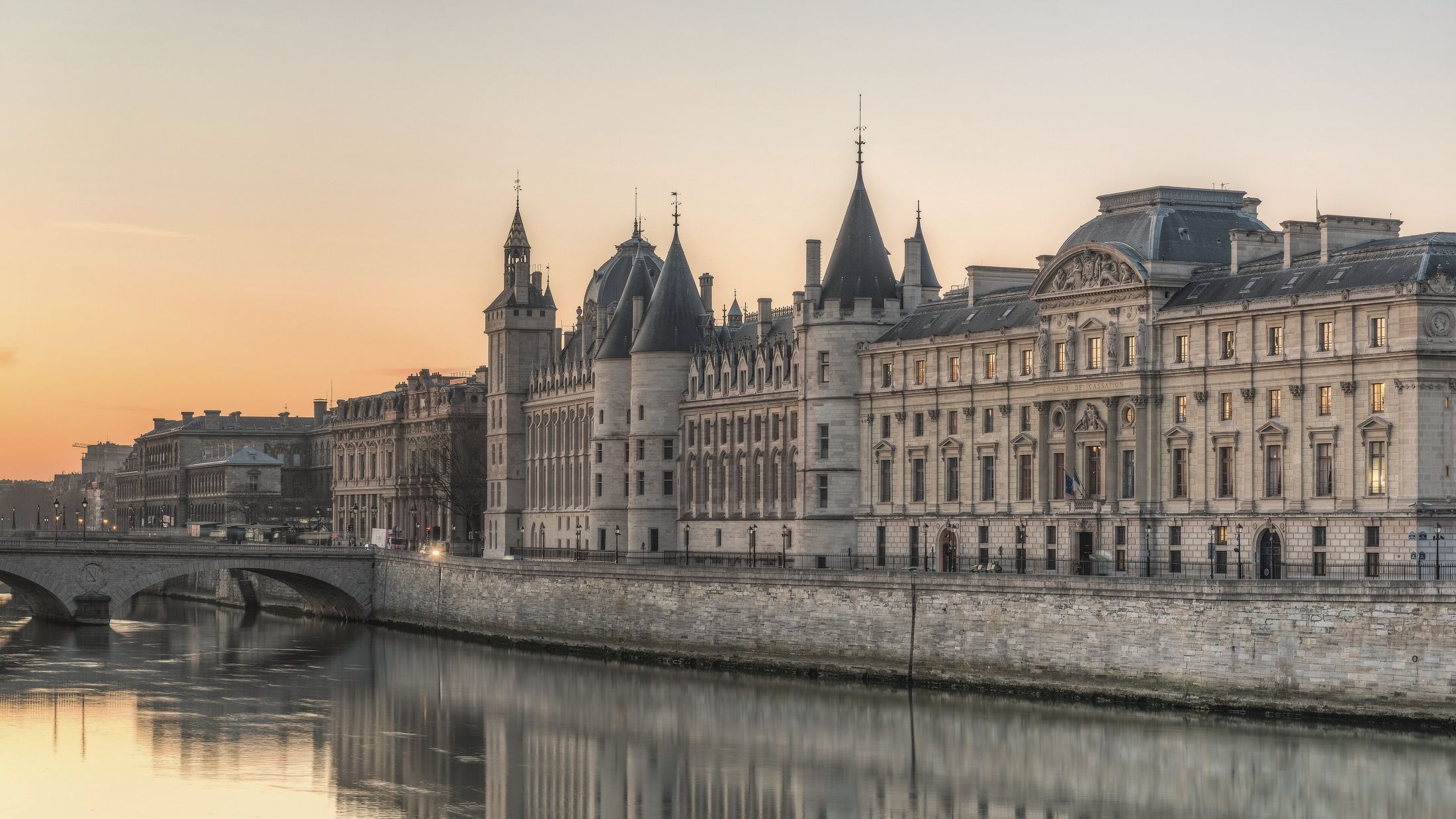 The Paris Palais de justice and the Conciergerie on the Île de la Cité, seen from the Seine at dawn